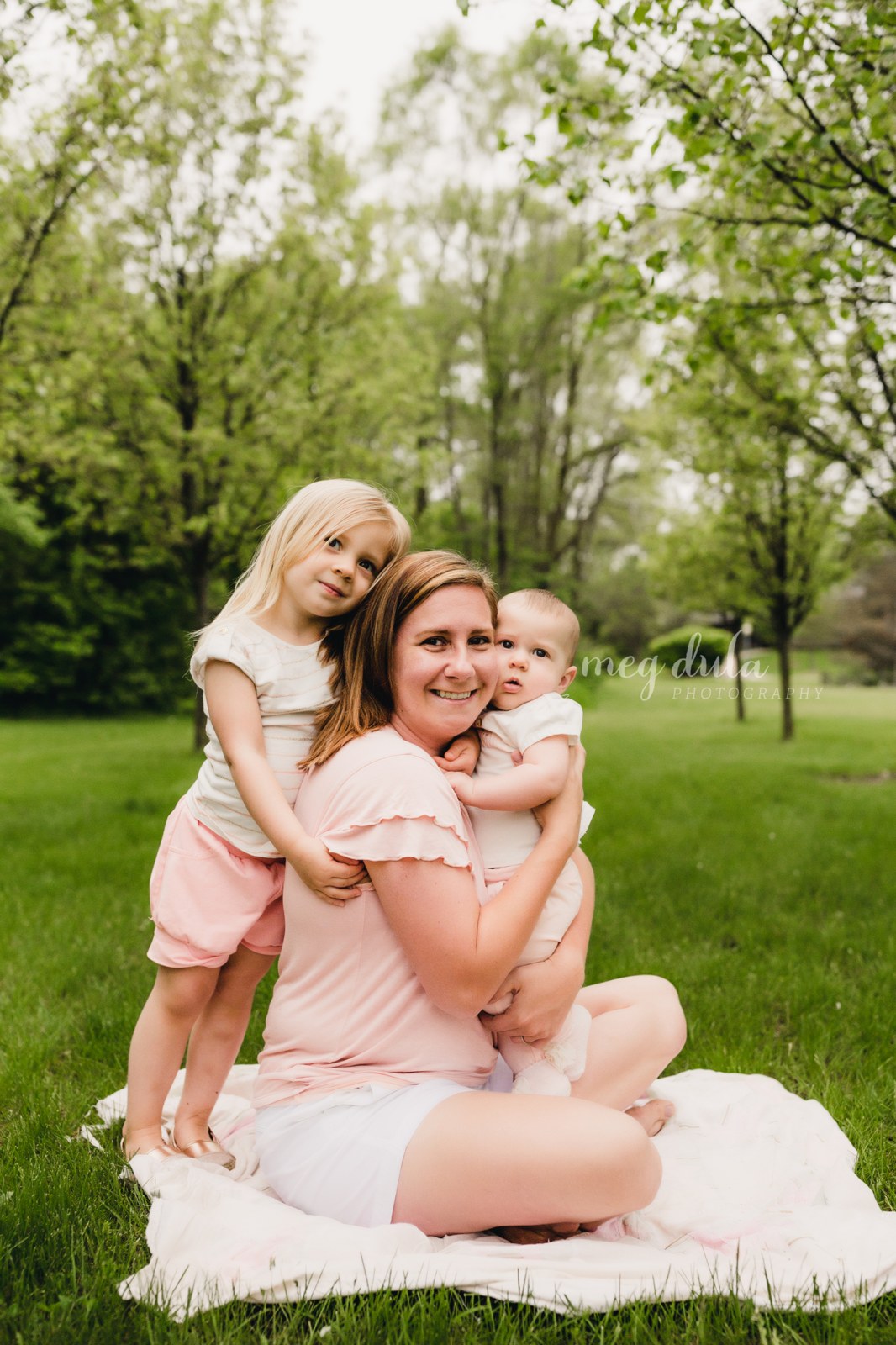 Lisa and her two daughters outdoors